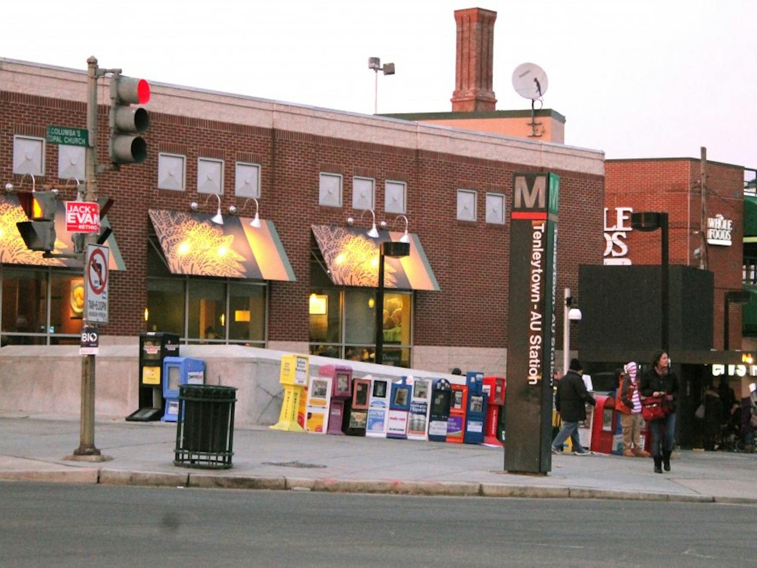 People stand near the Tenleytown Metro stop in 2014.